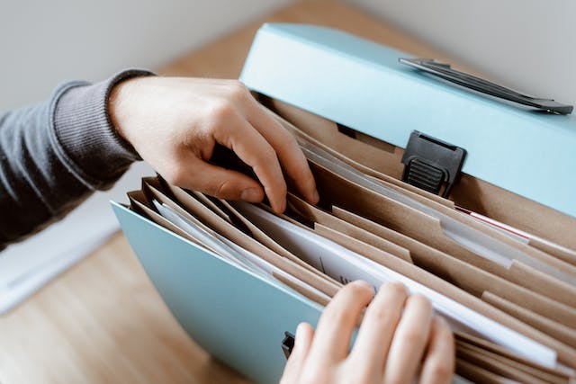 A person sorting through files.