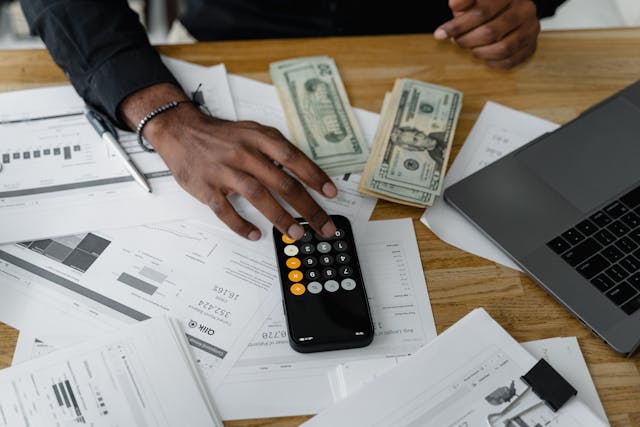 a person managing finances at a desk