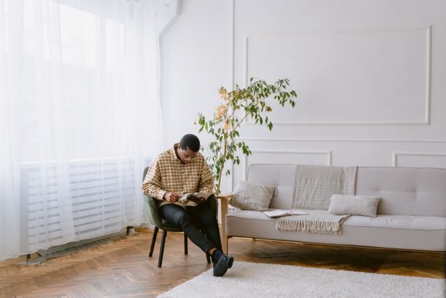 a person reading in their living room
