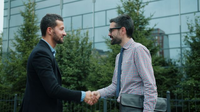 two people shaking hands