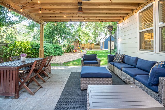 a renovated backyard with a seating area
