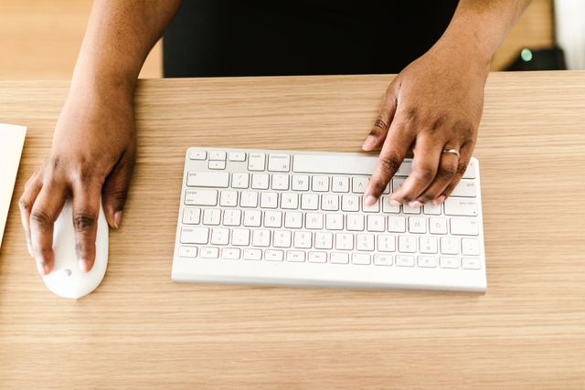 a person typing on a keyboard