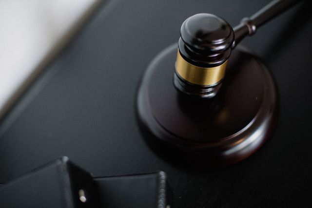 a wooden gavel on a desk