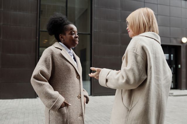two people talking outside